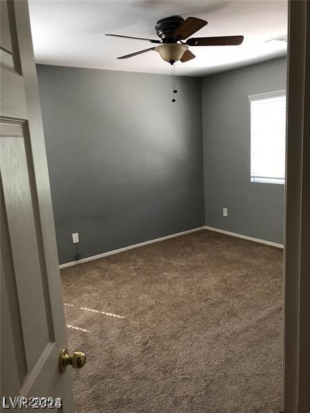 carpeted empty room with ceiling fan