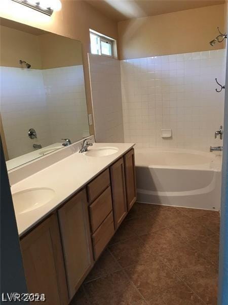 bathroom with shower / tub combination, tile patterned floors, and vanity