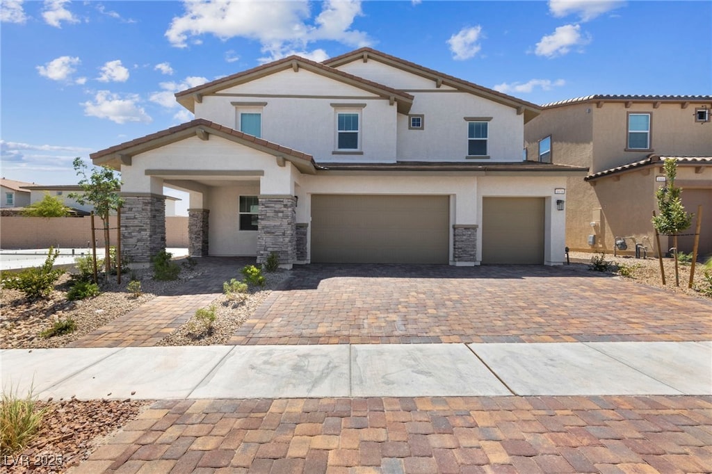 view of front of property with a garage