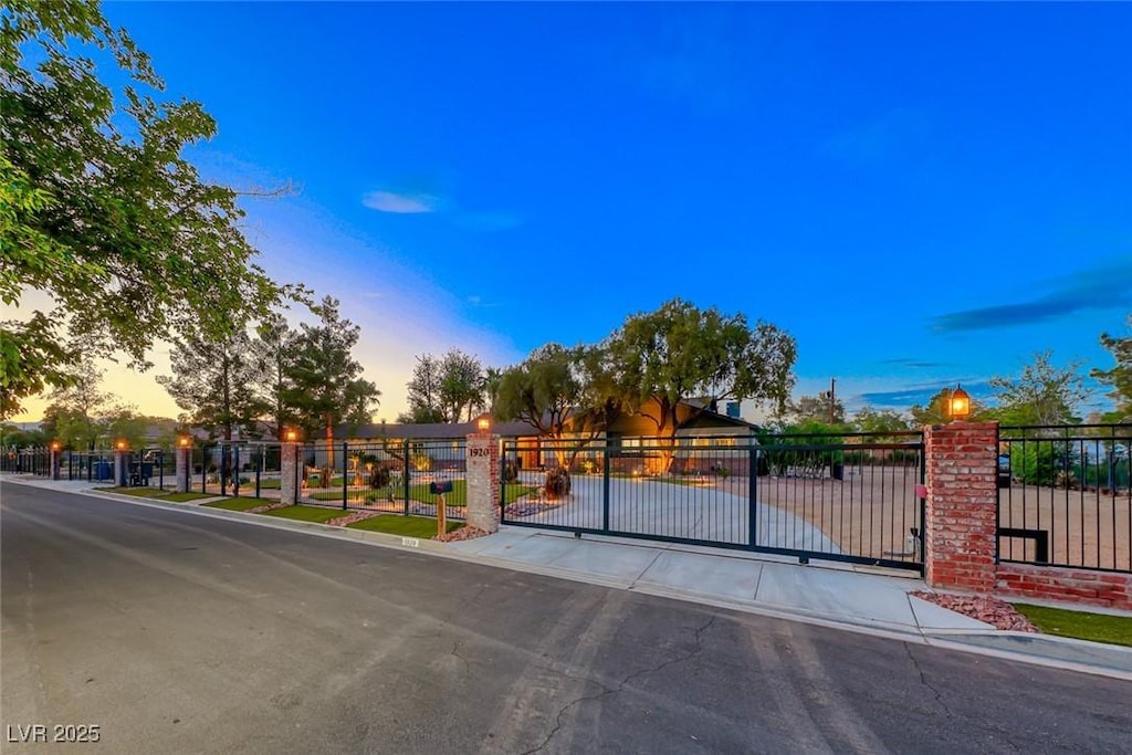 view of gate at dusk