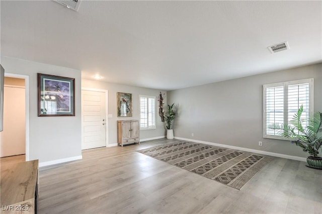 foyer entrance featuring light wood-type flooring