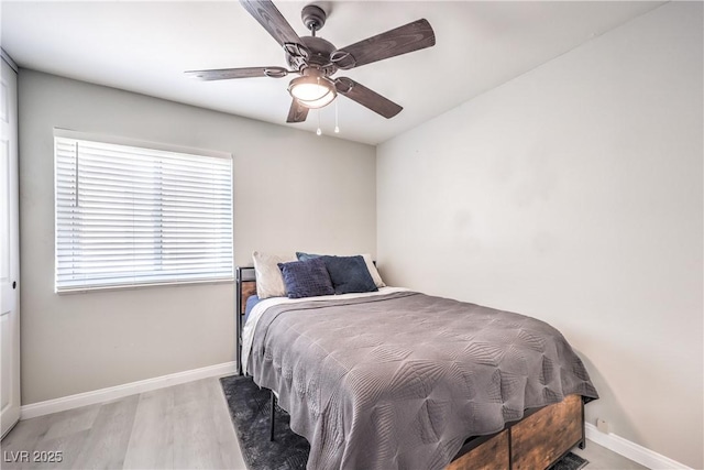 bedroom featuring ceiling fan and light hardwood / wood-style floors