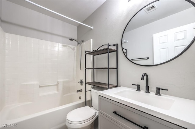 full bathroom with vanity, shower / tub combination, and toilet