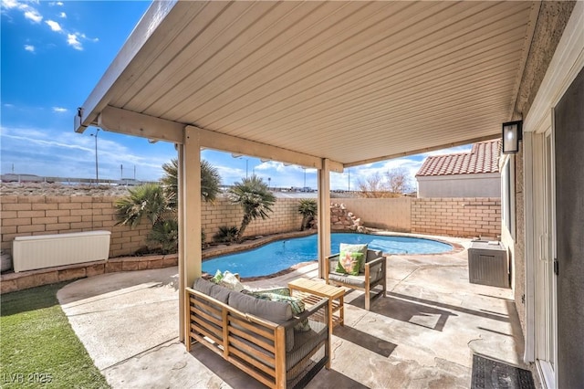 view of patio featuring a fenced in pool