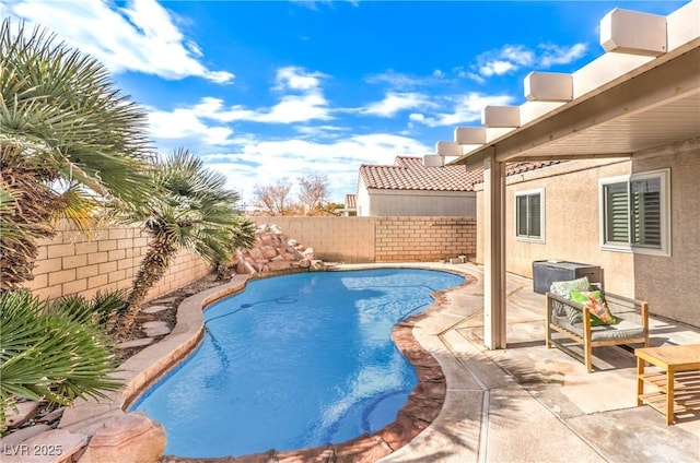 view of swimming pool with a patio area