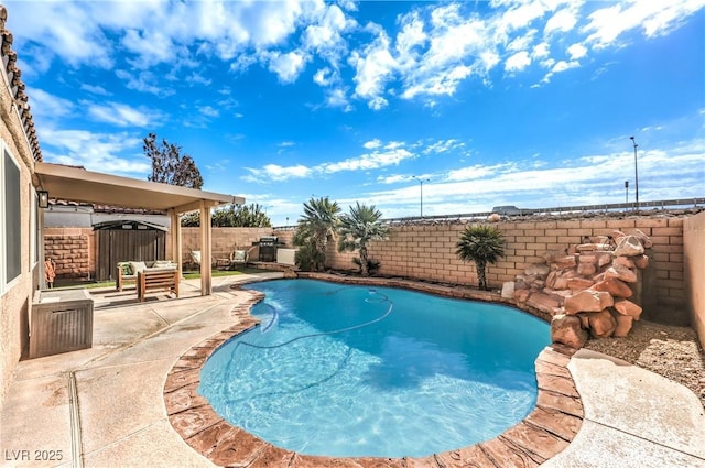 view of swimming pool featuring a patio area