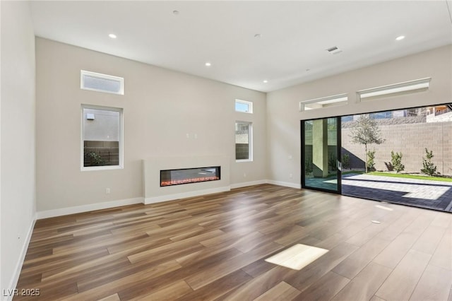 unfurnished living room with hardwood / wood-style flooring