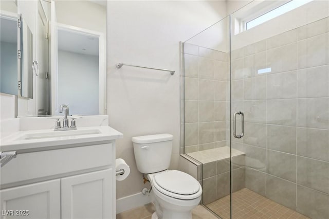 bathroom with vanity, toilet, and walk in shower