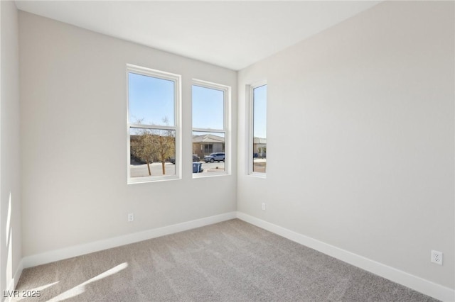 unfurnished room featuring carpet flooring