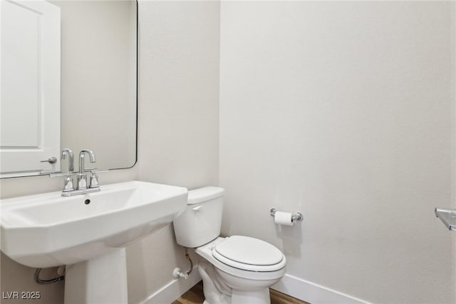 bathroom with toilet and sink