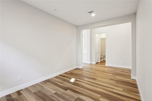 spare room featuring light hardwood / wood-style floors