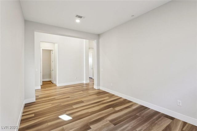 unfurnished room featuring hardwood / wood-style floors