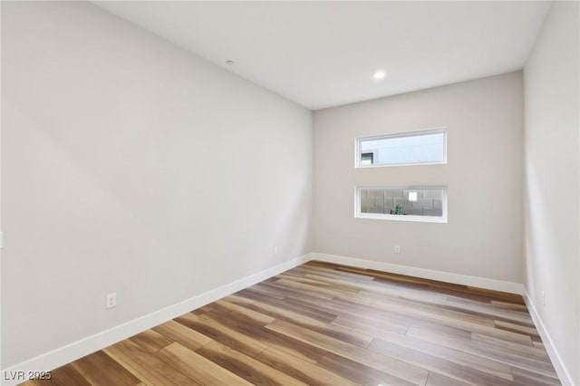 spare room with light hardwood / wood-style flooring