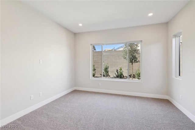 spare room featuring carpet floors