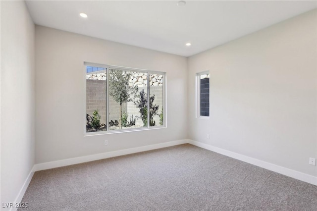 unfurnished room with carpet floors