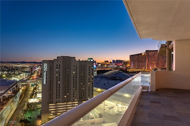 view of balcony at dusk