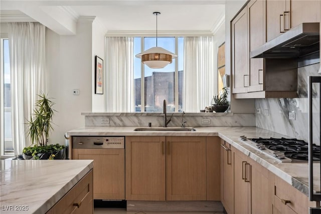 kitchen featuring sink, stainless steel gas stovetop, and light brown cabinets