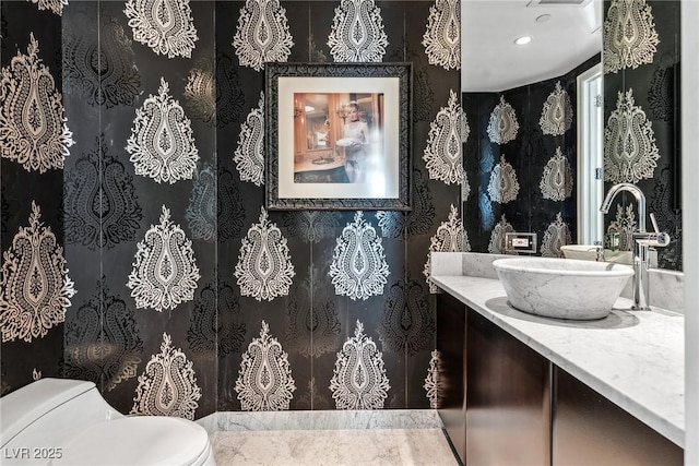 bathroom with vanity and toilet