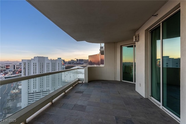 view of balcony at dusk