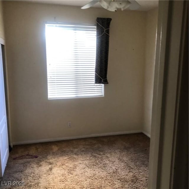 spare room with ceiling fan, a healthy amount of sunlight, and carpet floors