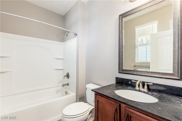 full bathroom with shower / tub combination, vanity, and toilet