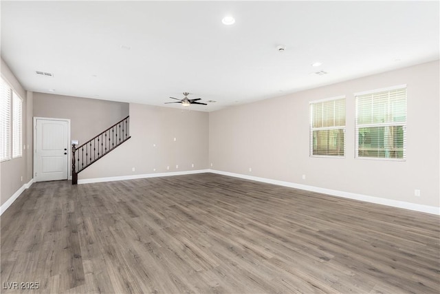 unfurnished room featuring hardwood / wood-style flooring and ceiling fan