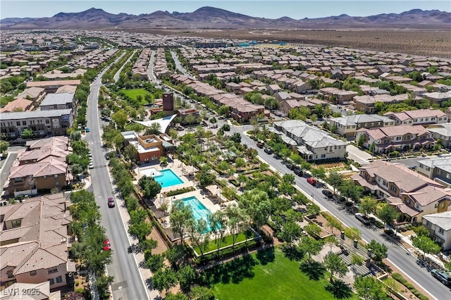 birds eye view of property featuring a mountain view