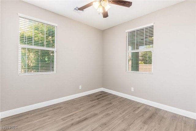 unfurnished room featuring light hardwood / wood-style flooring and ceiling fan