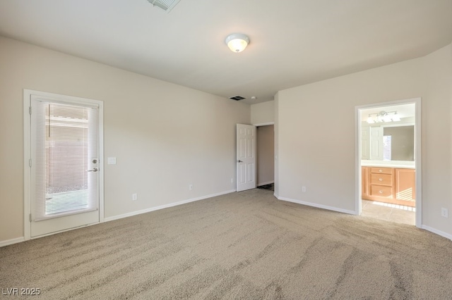 unfurnished room with light carpet