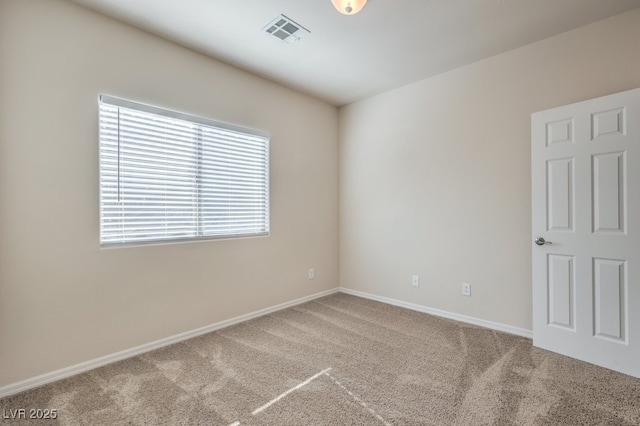 spare room featuring carpet flooring