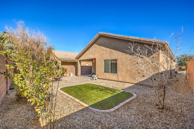 rear view of property featuring a patio area