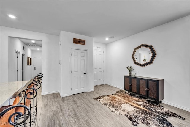 foyer with light hardwood / wood-style flooring