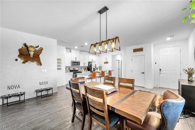 dining room with hardwood / wood-style floors