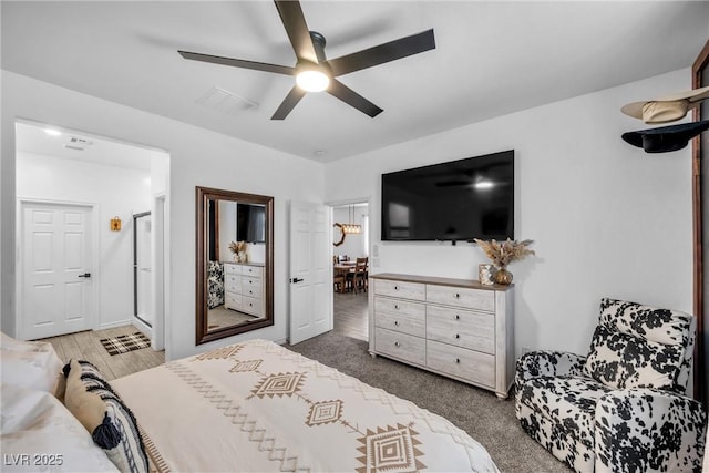 bedroom featuring dark carpet and ceiling fan