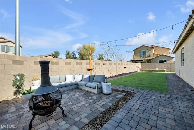 view of patio / terrace featuring an outdoor living space with a fire pit