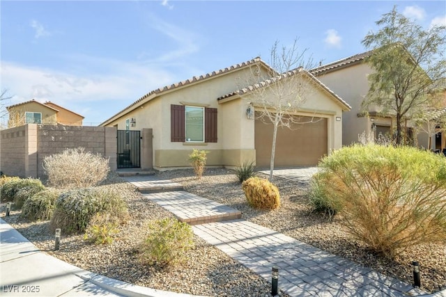 mediterranean / spanish-style home with a garage