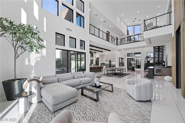 tiled living room with a towering ceiling