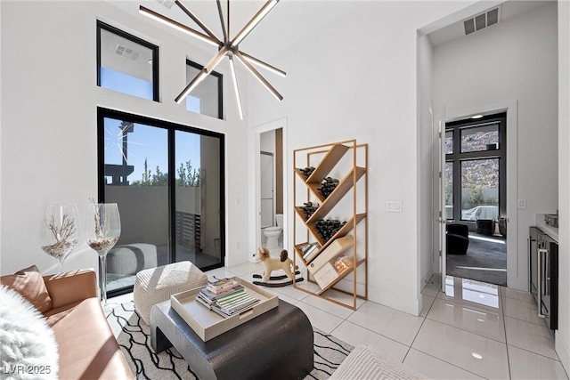 tiled living room with a high ceiling