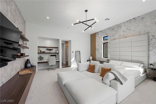 bedroom featuring built in desk and a notable chandelier