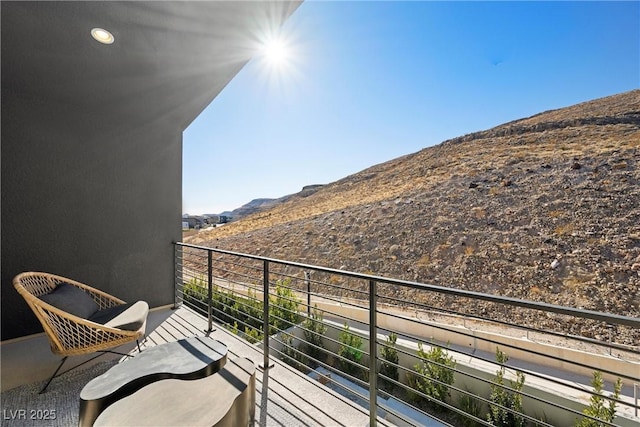 balcony featuring a mountain view