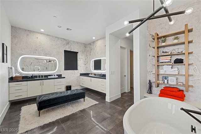 bathroom featuring vanity and a bathtub