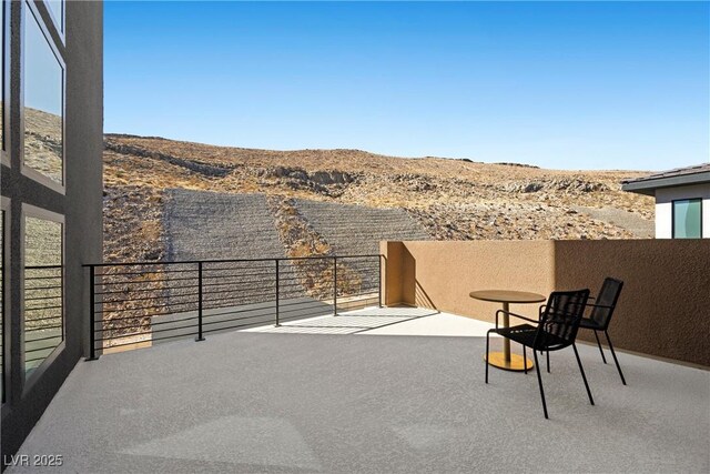 balcony featuring a mountain view