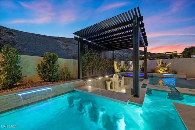 pool at dusk featuring pool water feature, area for grilling, a pergola, and a patio