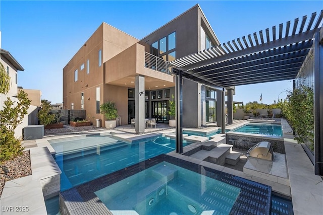 view of pool with an in ground hot tub, area for grilling, a pergola, and a patio