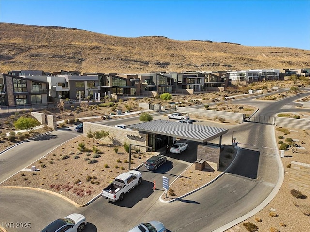 birds eye view of property featuring a mountain view