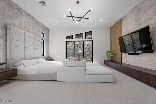 bedroom with light carpet and a notable chandelier