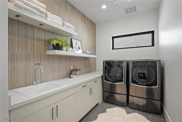 laundry room with sink and washer and clothes dryer