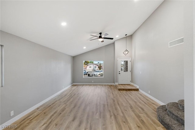 unfurnished living room featuring ceiling fan, high vaulted ceiling, and light hardwood / wood-style floors