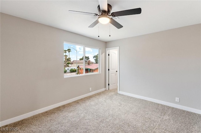 unfurnished room with ceiling fan and carpet floors