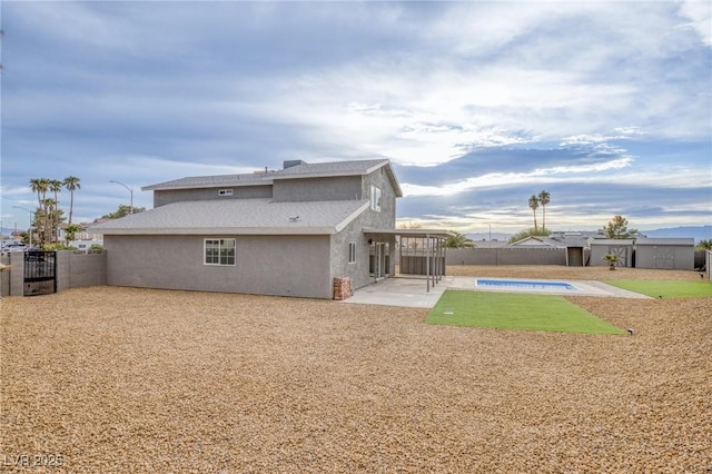 back of property featuring a patio area